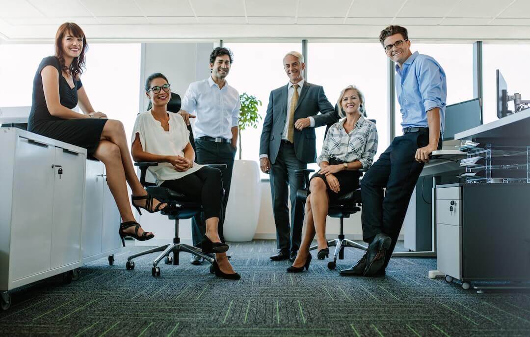 Portrait of successful business people looking at camera and smiling