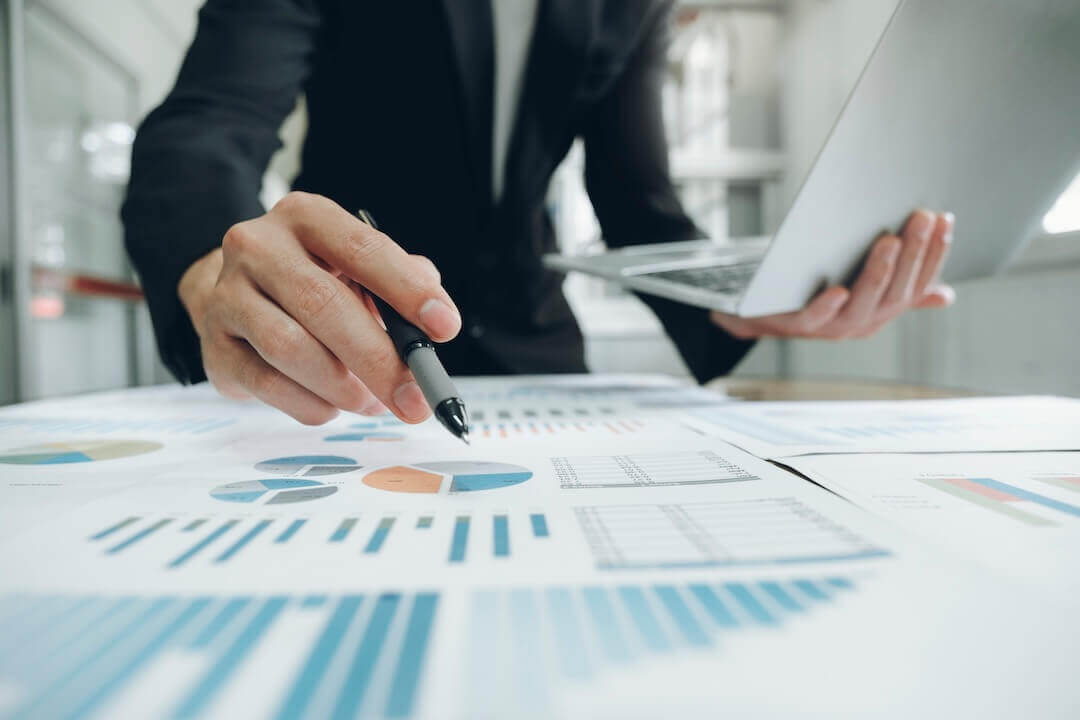 Businessman planning and analyzing charts and graphs data.